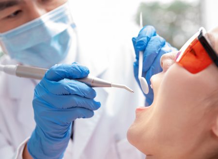 Before dental implant treatment for patient with deteriorating teeth in NYC